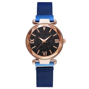 Detail of rose gold starry sky watch dial with blue magnetic milanese stainless steel mesh band