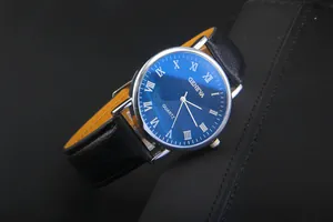 Detail of blue sunray dial with Roman numerals and black leather strap on a quartz watch