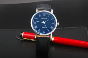 Detailed close-up of a blue Roman numeral dial Geneva quartz watch with a sleek red pen