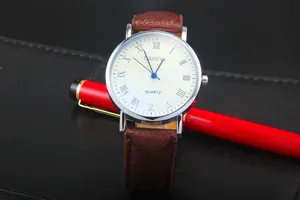Macro view of Geneva quartz watch featuring white dial with Roman numerals and brown leather strap