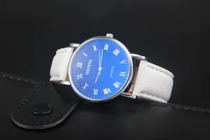 Close-up of Geneva quartz watch featuring blue dial, Roman numerals, and white leather strap