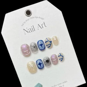 Handmade press-on nails with 3D star patterns and metallic mirror finish designs
