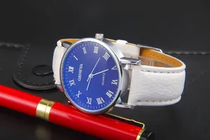 Geneva quartz watch with blue Roman numeral dial and white leather strap on desk