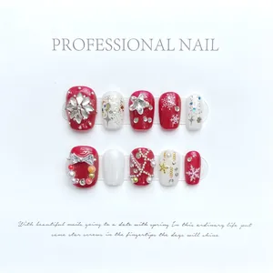 Uñas postizas de Navidad hechas a mano con copos de nieve rojos y blancos y cristales 3D