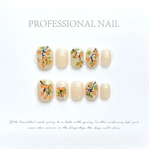 Hand-painted press-on nails set featuring 3D orange persimmon and green leaf nail art