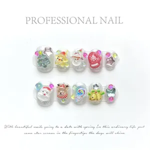 3D Christmas press-on nails featuring Santa, snowman and glitter silver finish