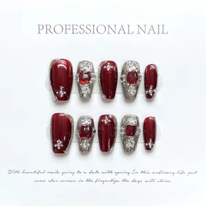 Macro shot of 10pcs luxury burgundy and silver press-on nails with pearls and rhinestones