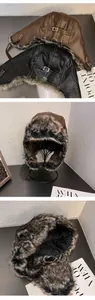 Close-up of faux leather trapper hat with soft fur lining and adjustable metal buckle