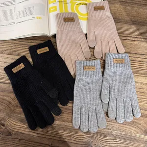 Warm knitted winter gloves with touch screen design in black, grey and khaki colors