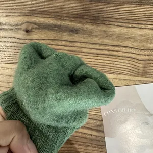Deep green knitted gloves with thick plush fleece lining and touchscreen capability