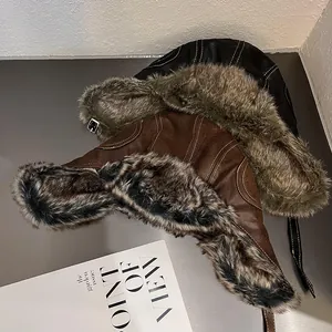 Faux leather and suede aviator hats with faux fur lining and chin strap for winter warmth