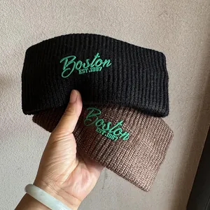 Thick knitted beanie hats in black and dark brown with green Boston embroidery