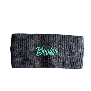 Knitted sports headband with green Boston EST. 1987 embroidery for winter warmth