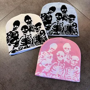 Skull pattern knitted beanies in white, blue, and pink for Halloween parties