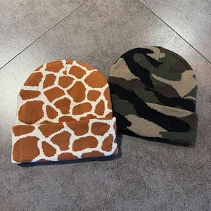 Knitted beanie hats set featuring giraffe print and classic camouflage pattern for winter