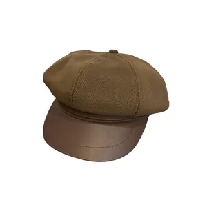Retro dark brown newsboy cap with knitted fabric crown and smooth leather brim for women
