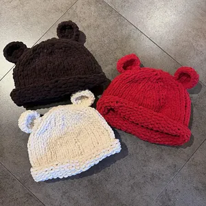 Winter chunky knit beanie with cute bear ears in brown, red, and beige colors