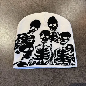 Close-up of the skull bone jacquard pattern and knit texture on this white beanie