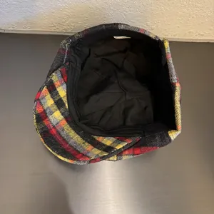 Classic plaid newsboy cap with red and yellow checkered wool pattern for men and women