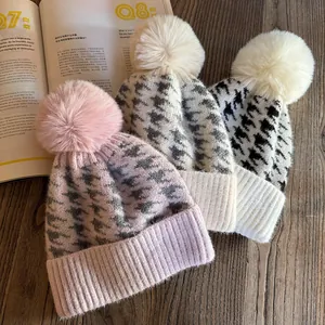 Chic houndstooth knit beanies with fluffy pom poms in pink, beige and white styles