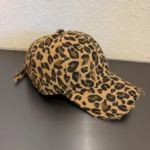 Distressed leopard print baseball cap with vintage frayed details and adjustable strap