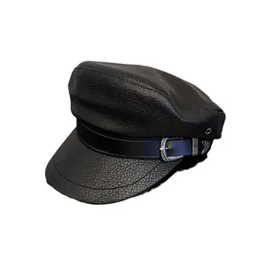 Dark retro black PU leather newsboy cap with vintage silver engraved buckle on white background