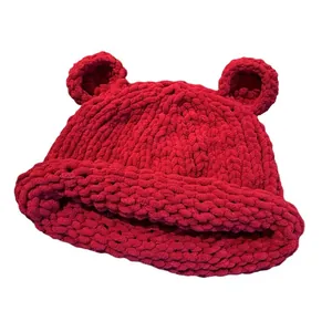 Thick red knit beanie with cute bear ears and rolled edge for winter warmth