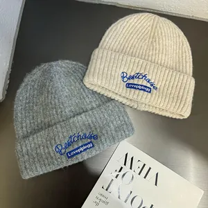 Knitted beanie hats in dark grey and beige with Bestchoise embroidery for autumn warmth