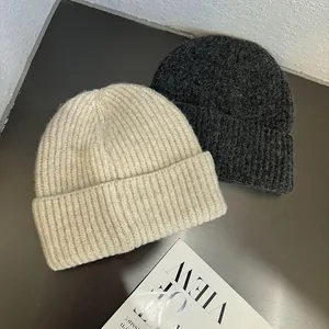 Minimalist ribbed knit beanie hats in beige and dark grey with thick folded cuffs