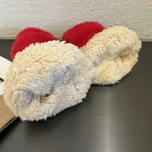 Winter faux mink fur mittens in red and cream plush fabric with heart pattern design