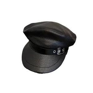 Classic black faux leather newsboy cap with buckle strap and pebbled texture finish