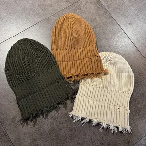 Distressed knit beanies in olive, caramel, and beige colors with vintage frayed details
