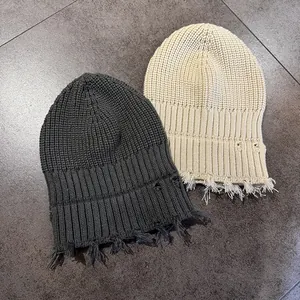 Distressed distressed knit beanies in dark grey and beige with retro street style