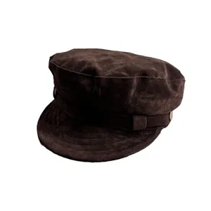 Vintage brown suede newsboy cap with decorative strap and buttons for autumn and winter