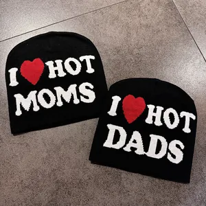 Knitted black beanies with I Love Hot Moms and Dads slogan and red heart pattern