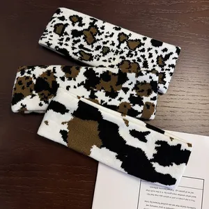 Three-pack of knitted cow print headbands with soft elastic texture for sports and yoga