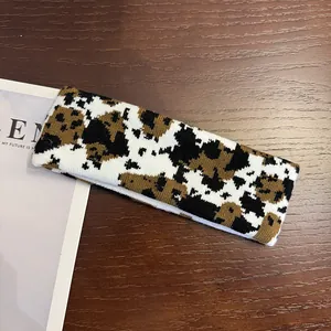 Close-up of a cow pattern knitted sports headband with high-elasticity fabric texture