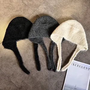 Winter knitted balaclava ear protection hats in black, grey, and beige with tie straps