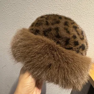 Women's leopard print plush bucket hat with thick faux fur trim for winter warmth