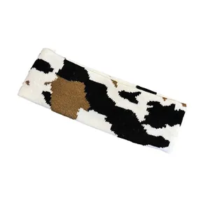 Knitted cow pattern sports headband with black and brown animal print for men and women