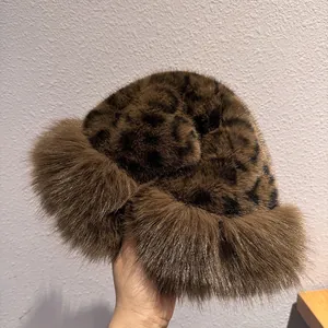 Detailed view of thick leopard print plush faux fur material on winter bucket hat