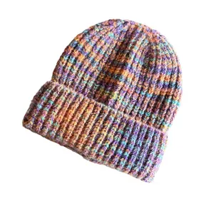 Women's warm chunky knit beanie with vibrant gradient multicolor yarn and folded cuff