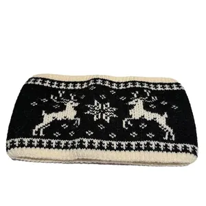 Jacquard knit winter headband with white reindeer and snowflake pattern in black and white