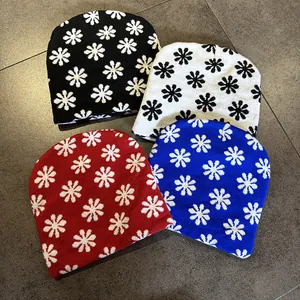 Set of four colorful knit beanies with jacquard snowflake patterns for winter outdoor wear