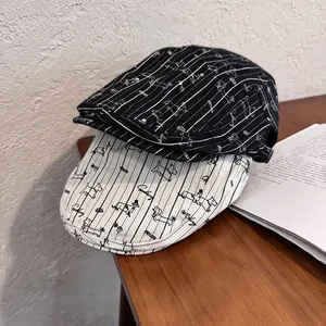 Detailed close-up of striped cotton newsboy caps with embroidered cartoon dog patterns