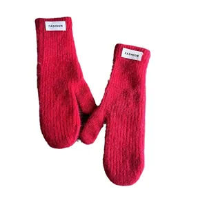 Red knit faux rabbit fur mittens with a white FASHION label for winter warmth