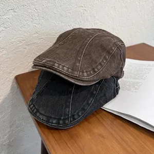 Vintage washed cotton beret hats in black and brown colors with retro distressed finish