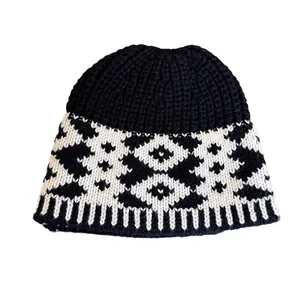 Vintage jacquard knit beanie with black and white geometric patterns and ribbed edge