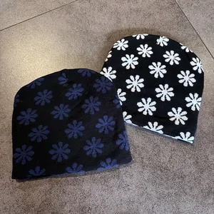 Unisex contrast knit beanies with snowflake patterns in black, white, and dark blue