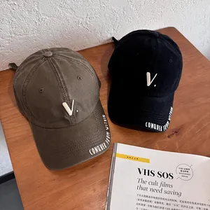 Classic cotton baseball caps in brown and black with embroidered letter V for a retro style